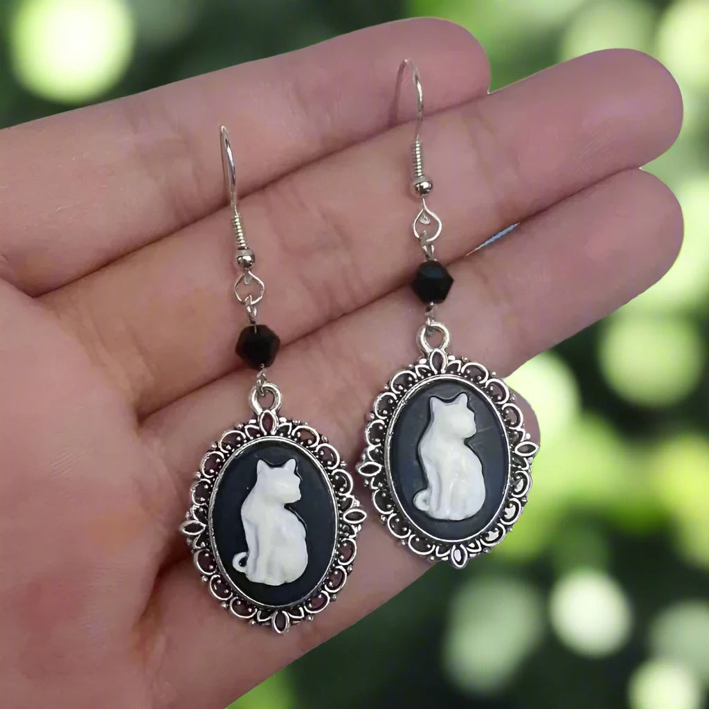 Emily & Isabella Brooks | Vintage White Cat Drop Earrings in Silver Frame