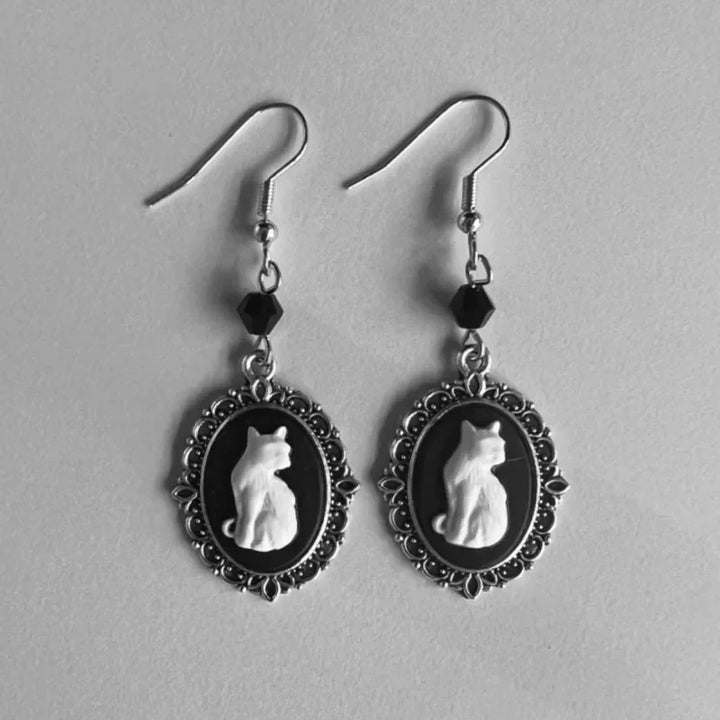Emily & Isabella Brooks | Vintage White Cat Drop Earrings in Silver Frame